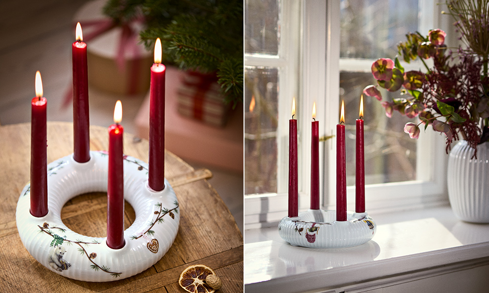 Kähler Design Hammershøi Jul Adventskranz aus weißem Porzellan mit vier roten Kerzen, Tannenzweigen und klassischen Weihnachtsmotiven als festliche Adventsdekoration.
