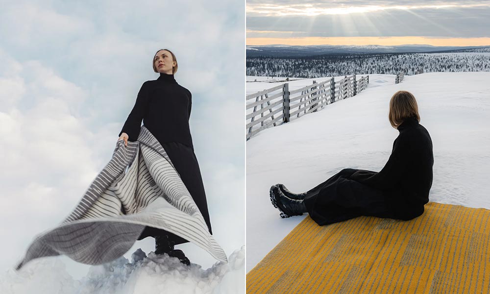 Auf dem linken Bild steht eine Frau in schwarzem Outfit auf schneebedecktem Boden und hält die AURORA Wolldecke in den Farben Grau-Weiß in der Hand. Der Wind fängt den Stoff ein, wodurch die elegante Linienführung des Designs besonders zur Geltung kommt. Der Himmel im Hintergrund ist bewölkt und vermittelt eine stille, nordische Atmosphäre – ganz im Einklang mit der Inspiration durch die Aurora Borealis.