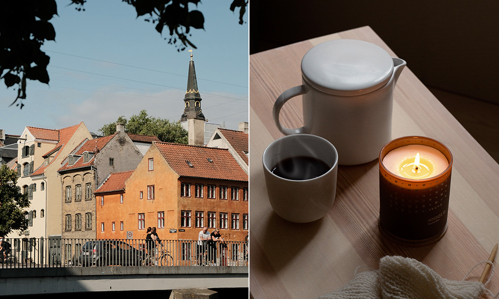Skandinavisk HYGGE Duftwelt mit brennender HYGGE Duftkerze, Teekanne und Tasse vor einer skandinavischen Stadtszene