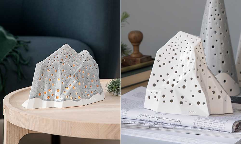 Links steht ein grauer Nobili Mountain auf einem Indskud-Beistelltisch von Skakerak. Rechts ein Ensemble aus zwei Nobili-Mountain-Teelichtleuchter und ein Nobili Kegel von Kähler Design.